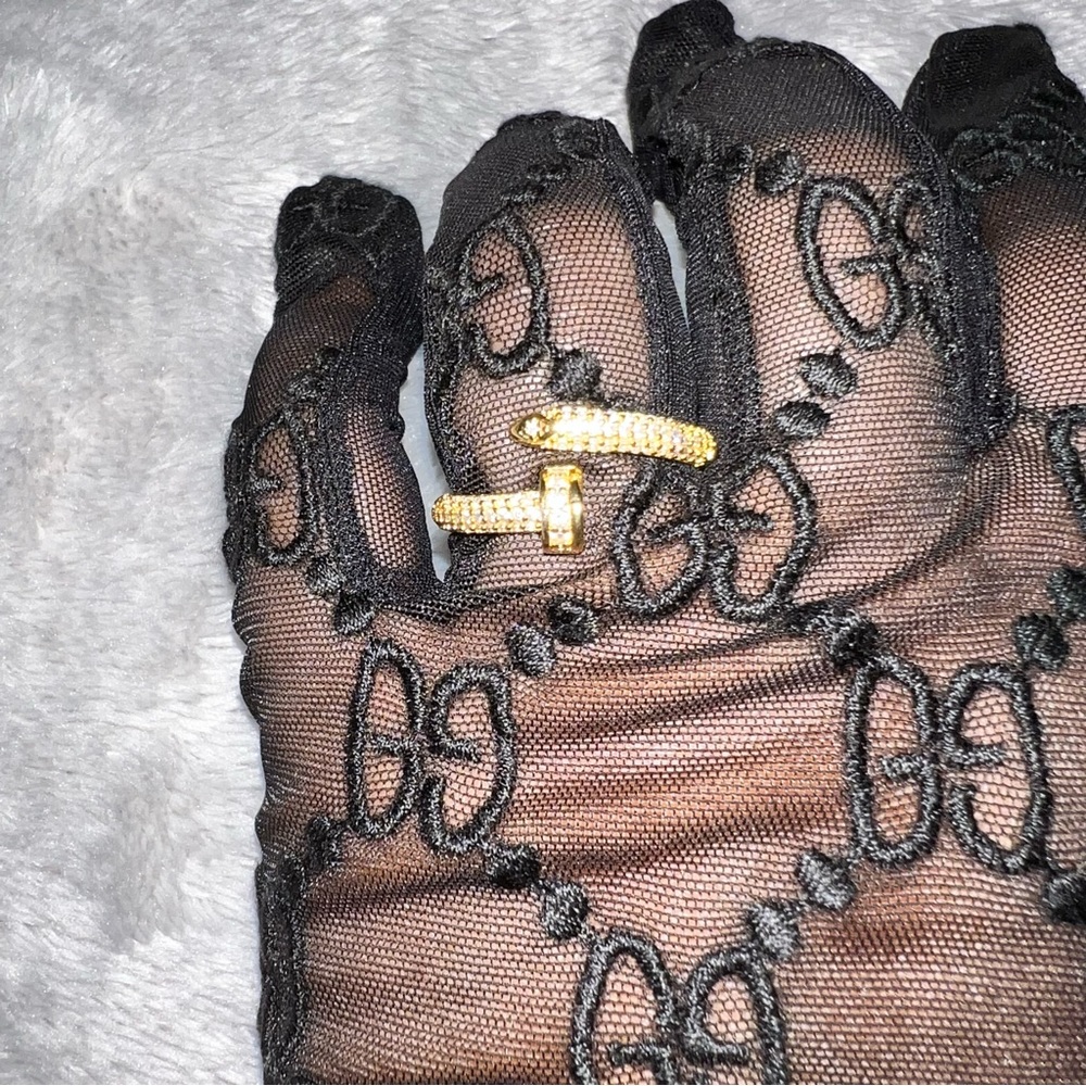 Adjustable Yellow Gold plated nail ring with cubic zirconia diamonds.